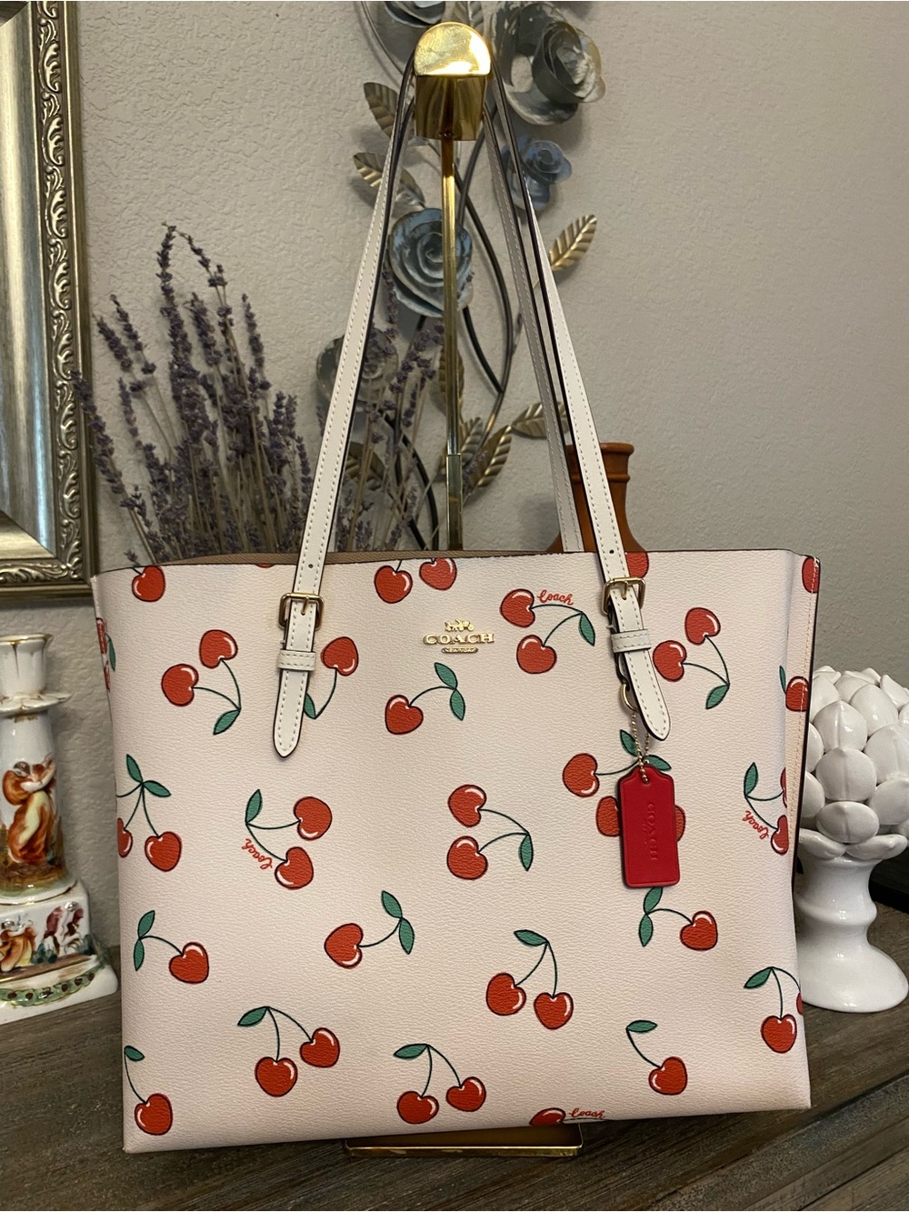 EUC Coach Mollie Tote in a Chalk Multi colorway featuring heart cherry print
